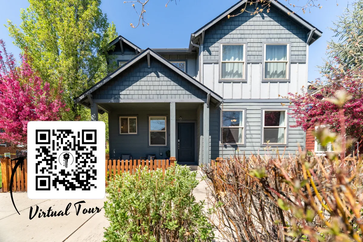 A vibrant front porch set against a garden of colorful trees, offering a welcoming space for family barbecues, outdoor gatherings, or simply enjoying the changing seasons.
